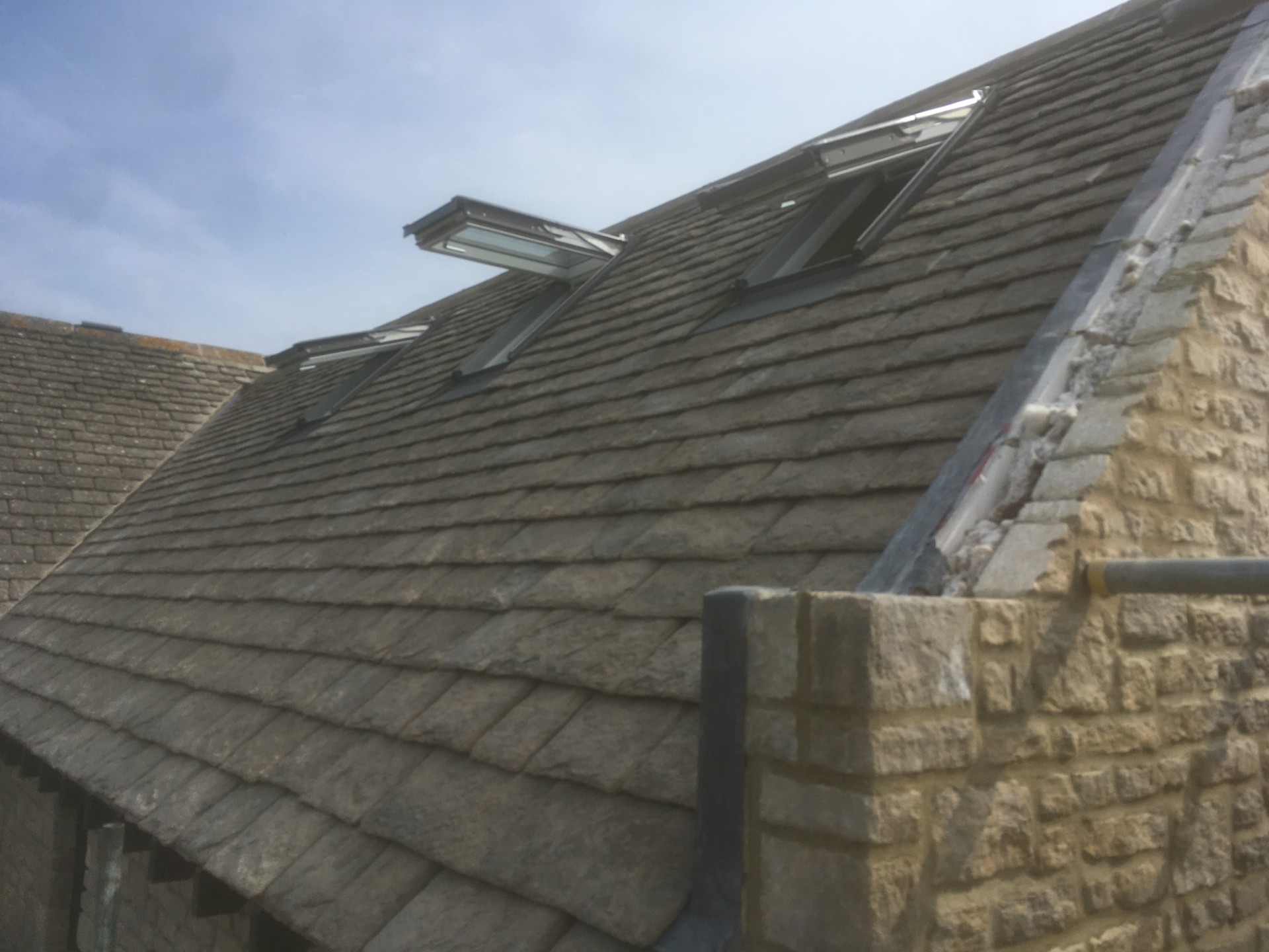 Stone tile roof with velux